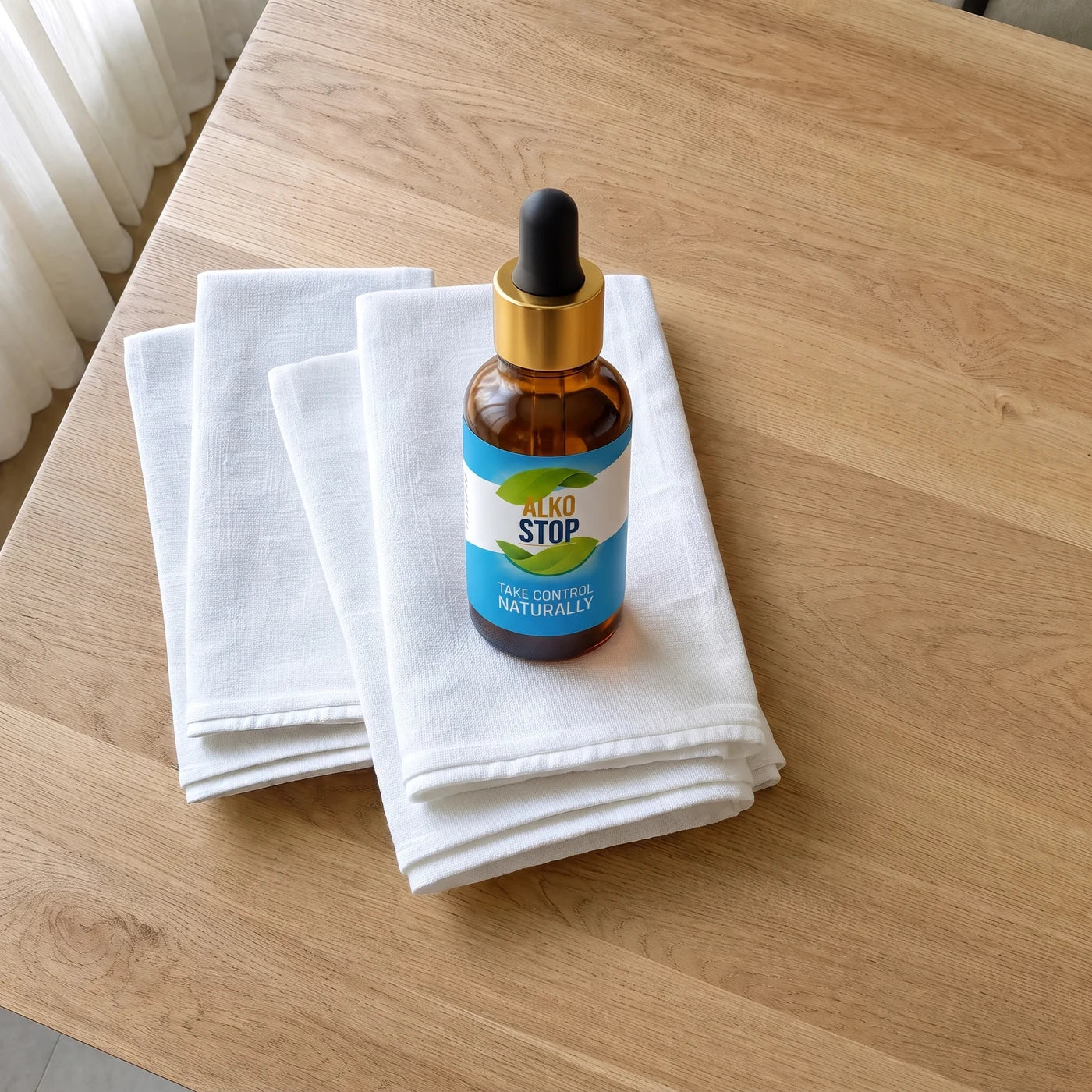 Open AlkoStop bottle with dropper on a clean wooden table