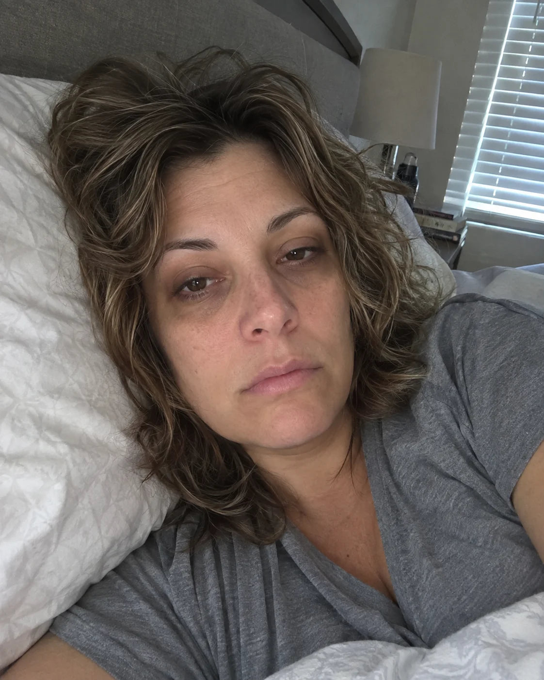 Woman waking up exhausted in the morning