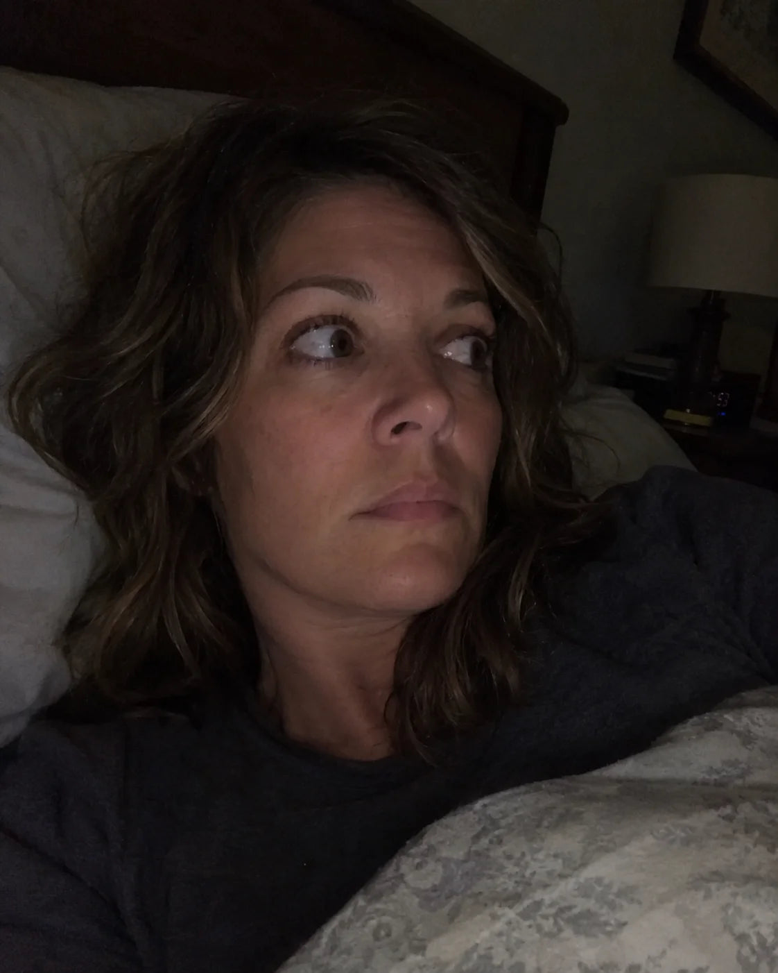 Woman awake in bed at 3am