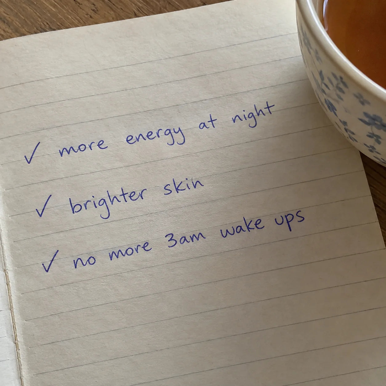 Handwritten journal checklist: more energy at night, brighter skin, no more 3am wake ups