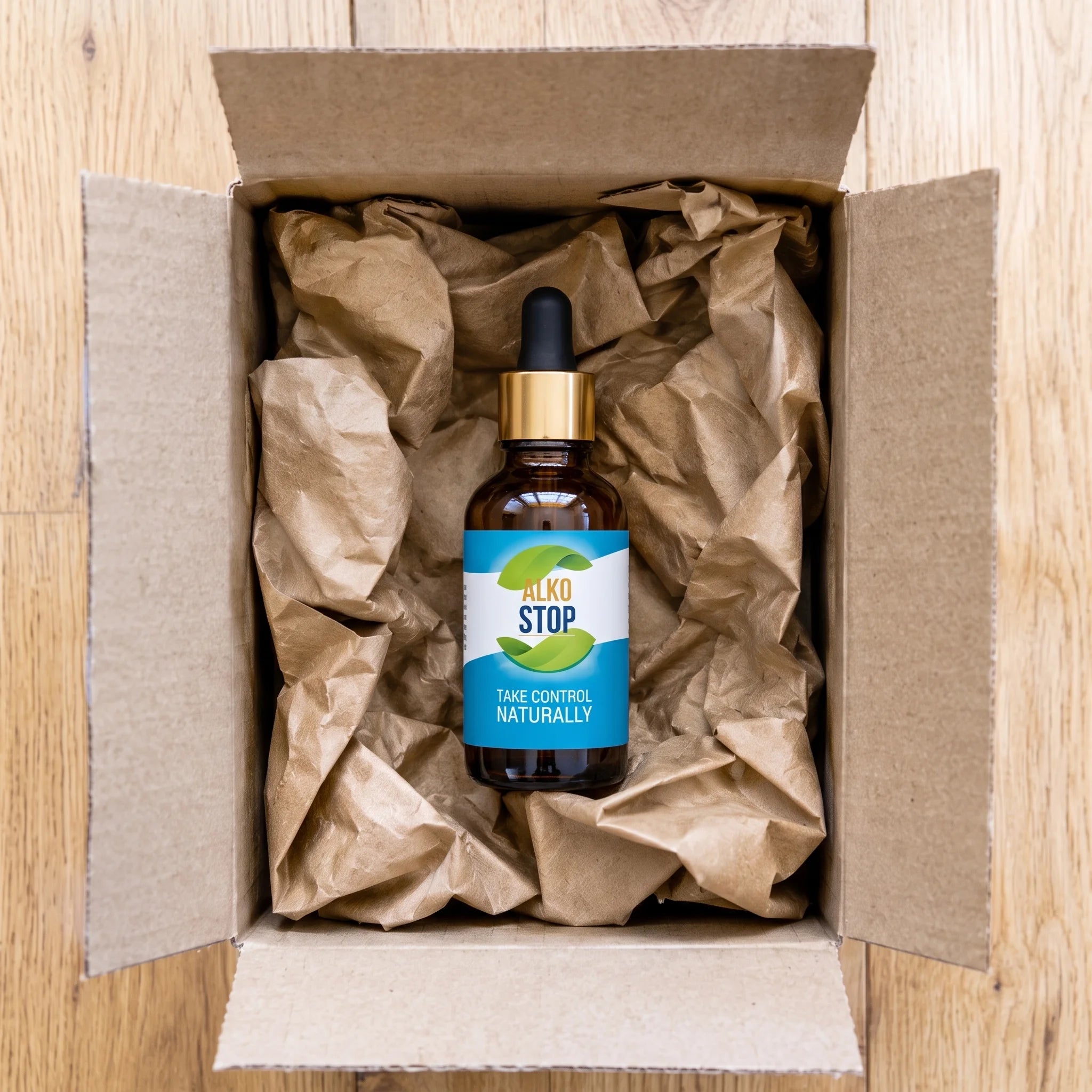 Overhead view of an AlkoStop bottle nestled in kraft paper inside an open shipping box