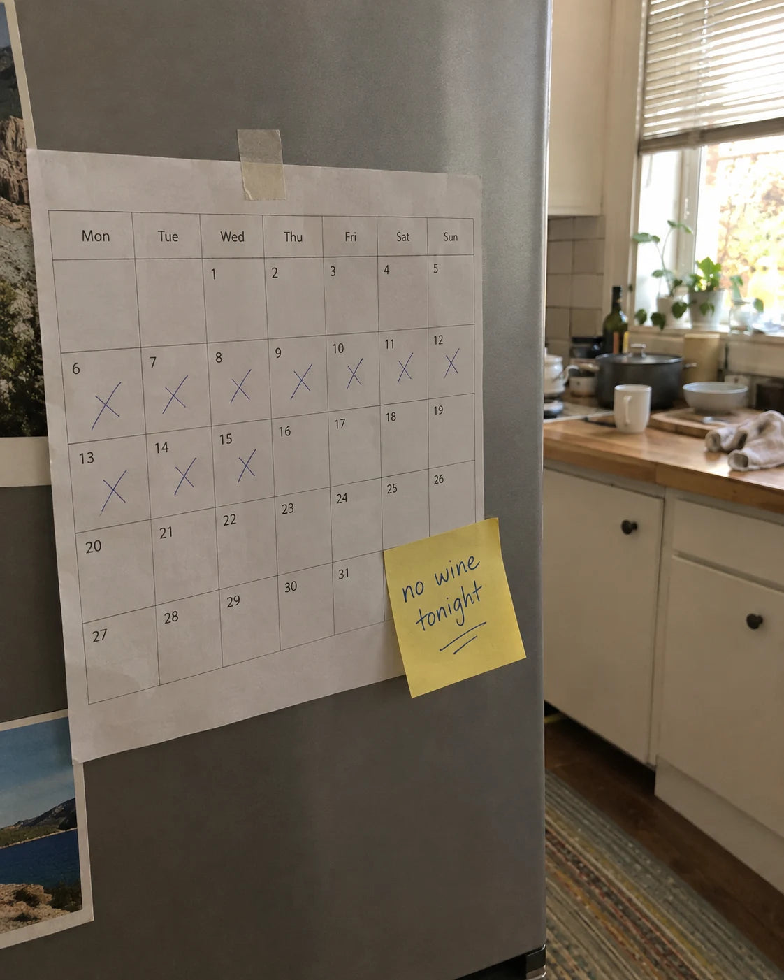 A kitchen calendar with crossed out days and a sticky note reading no wine tonight