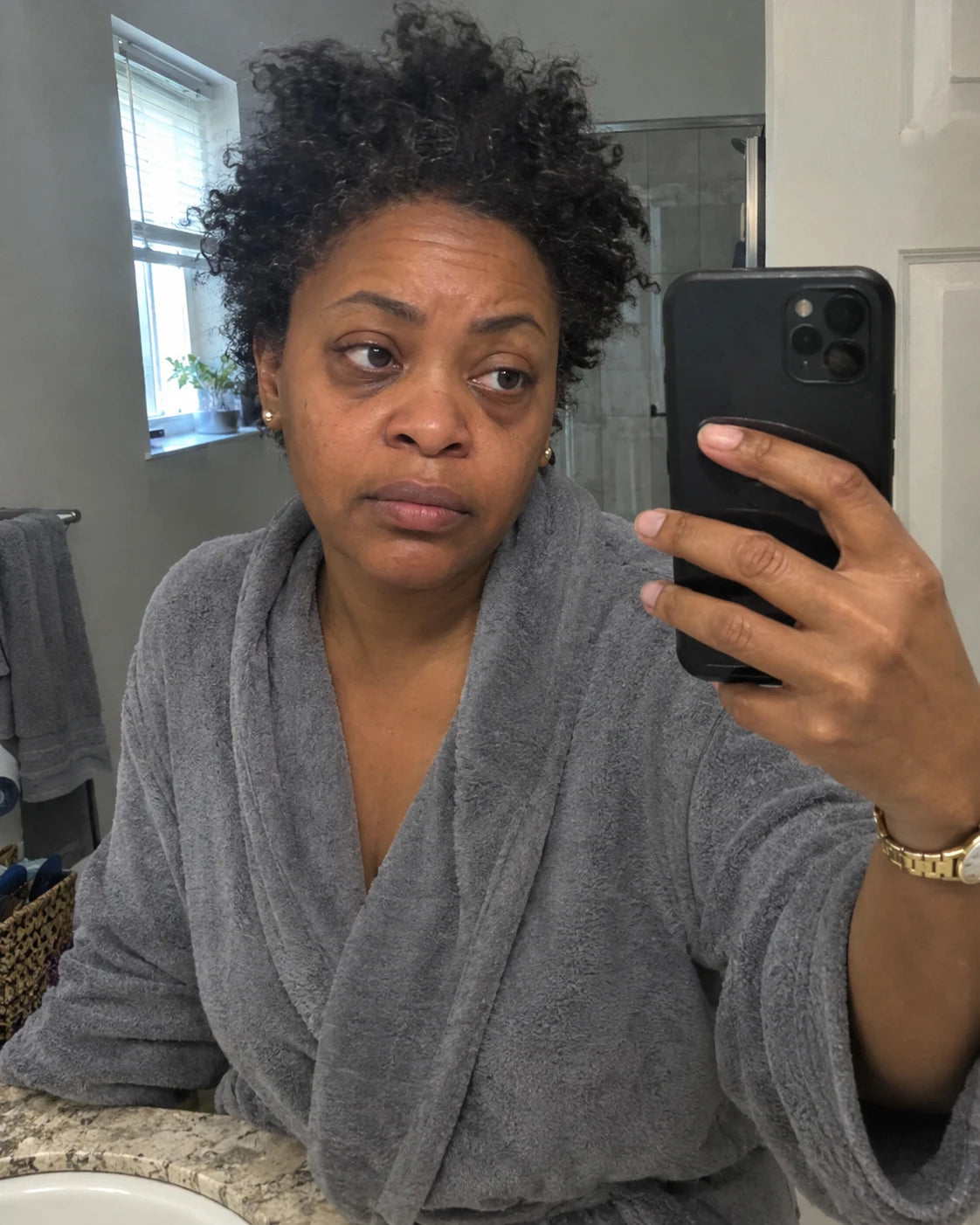 Woman's tired mirror selfie in the morning, puffy face